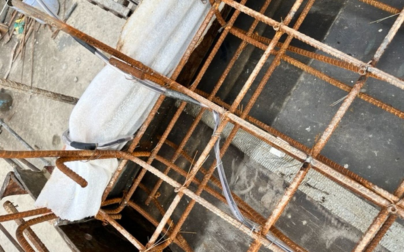 GIZMO sensors and cabling installed into a reinforcement cage on a live construction site, ahead of a concrete pour.